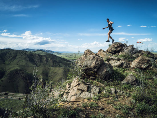 man-jumping-mountain